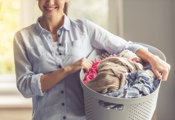 front-load top-load washers washing machines laundry smiling woman with laundry basket